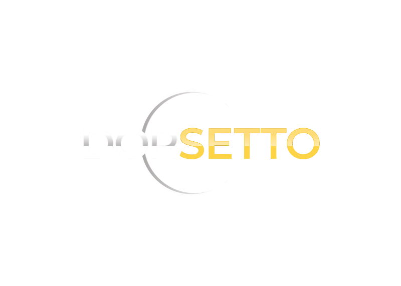 Bilden visar ordet DORSETTO med DOR i ljusgrått och SETTO i gult, mot en vit bakgrund. En svag halvcirkelformad skugga bildar en båge bakom texten för att framhäva den.